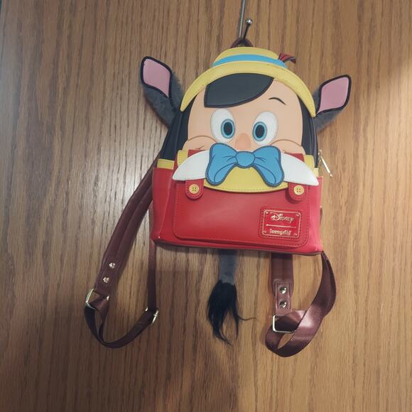 Loungefly Handbags - Disney Parks Pinocchio Loungefly Mini Backpack – Disney100 Magic Kingdom Movie